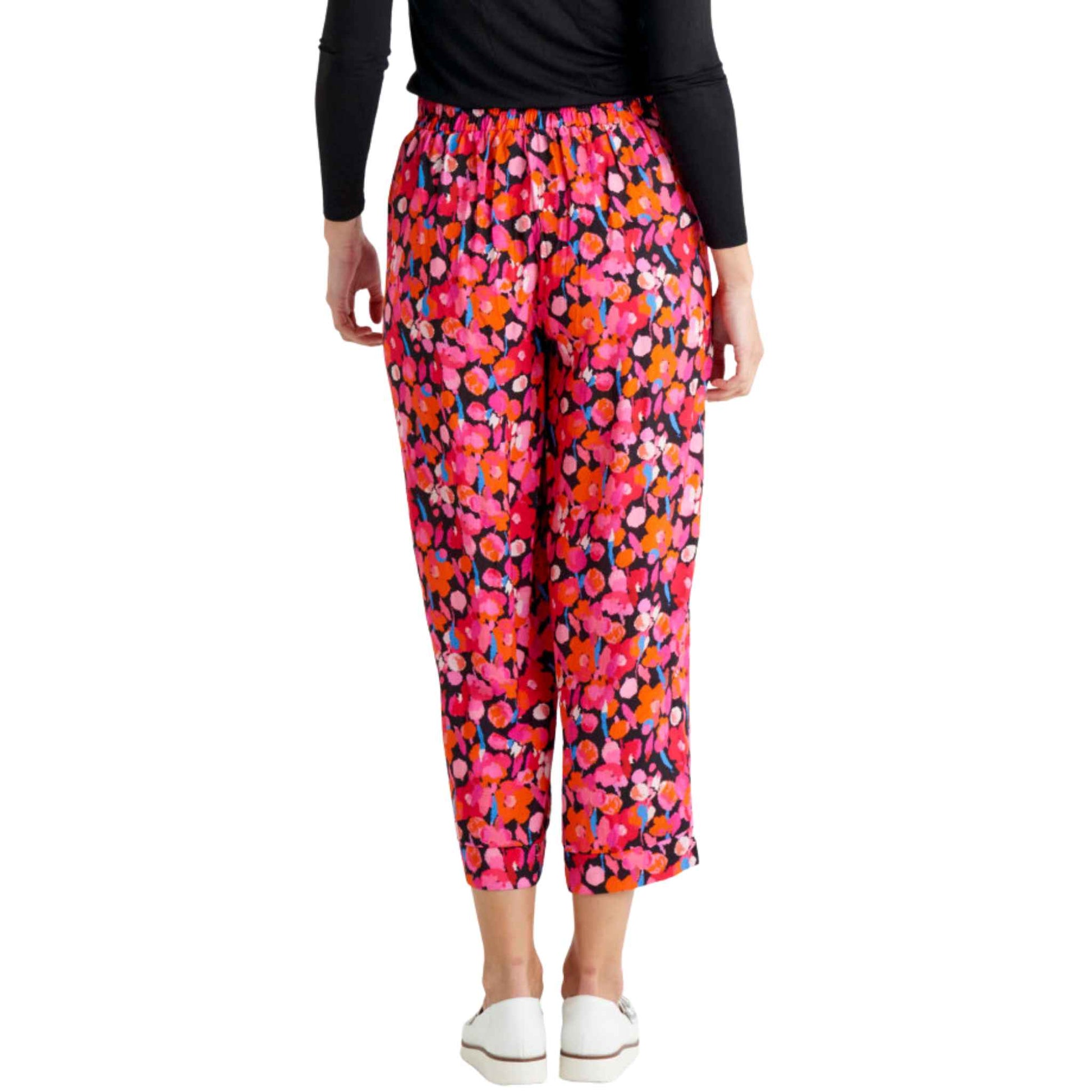 The Sarah pant from Betty Basics feature a flat front elastic waistband ensuring a snug and comfortable fit. With a relaxed fit from the hip to the leg, these pants offer a laid-back vibe. Plus, they come with pockets for added functionality. With a  beautiful pink and orange all over flower print  the Sarah pants are a stand out