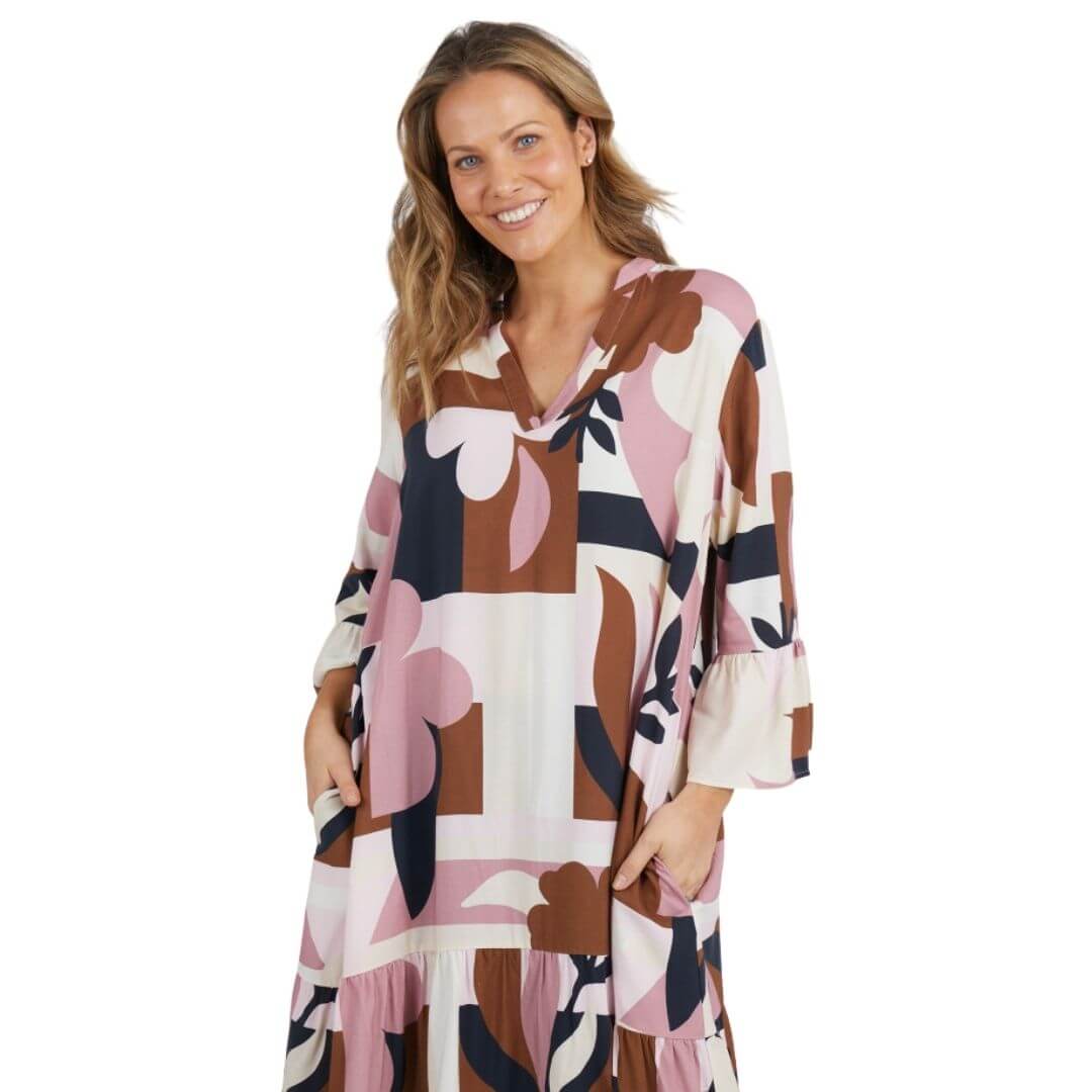 Featuring an Elm exclusive print, the Abstraction Dress is a knee length dress on a cream base with dusty pink, chocolate and navy print. with frill detail at the sleeve and hem adds a playful and feminine touch.