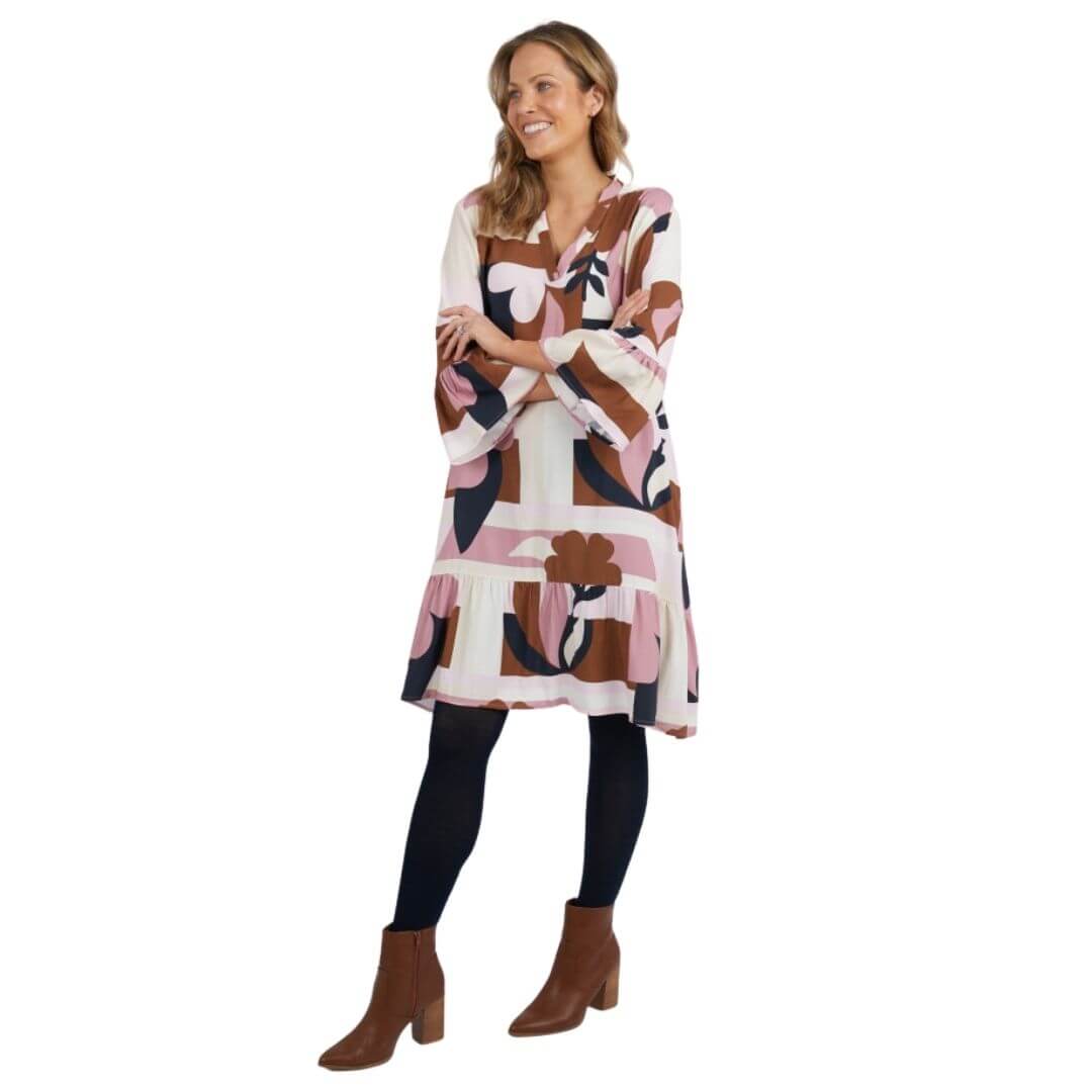 Featuring an Elm exclusive print, the Abstraction Dress is a knee length dress on a cream base with dusty pink, chocolate and navy print. with frill detail at the sleeve and hem adds a playful and feminine touch.