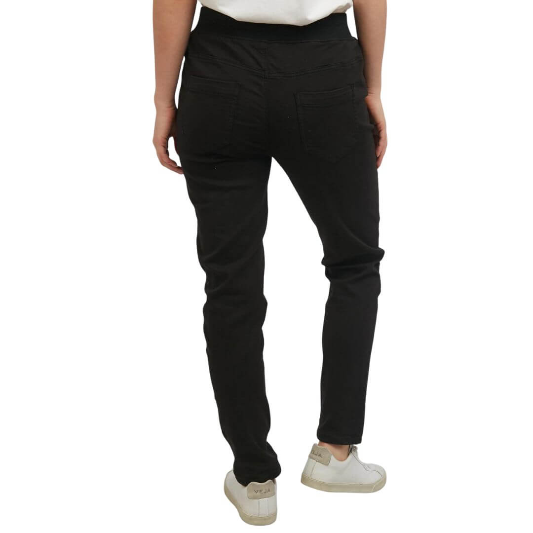 The black Sylvia joggers from Foxwood Clothing feature 2 side pockets, 2 back pockets, and an elastic waistline with a soft drawstring.
