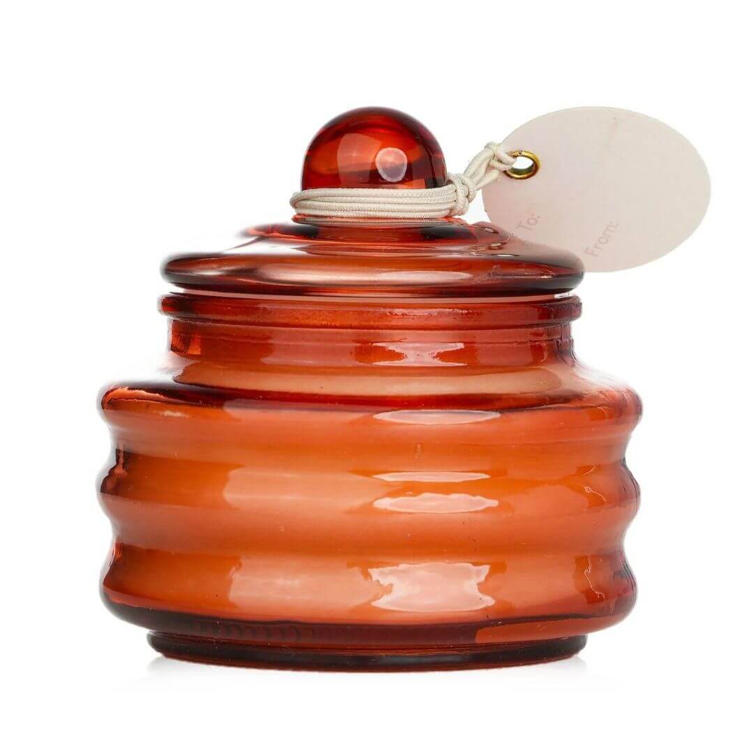 The Pombello Rose Beam Candle is made from cruelty free soy wax and is cased in a reusable orange glass jar with lid.