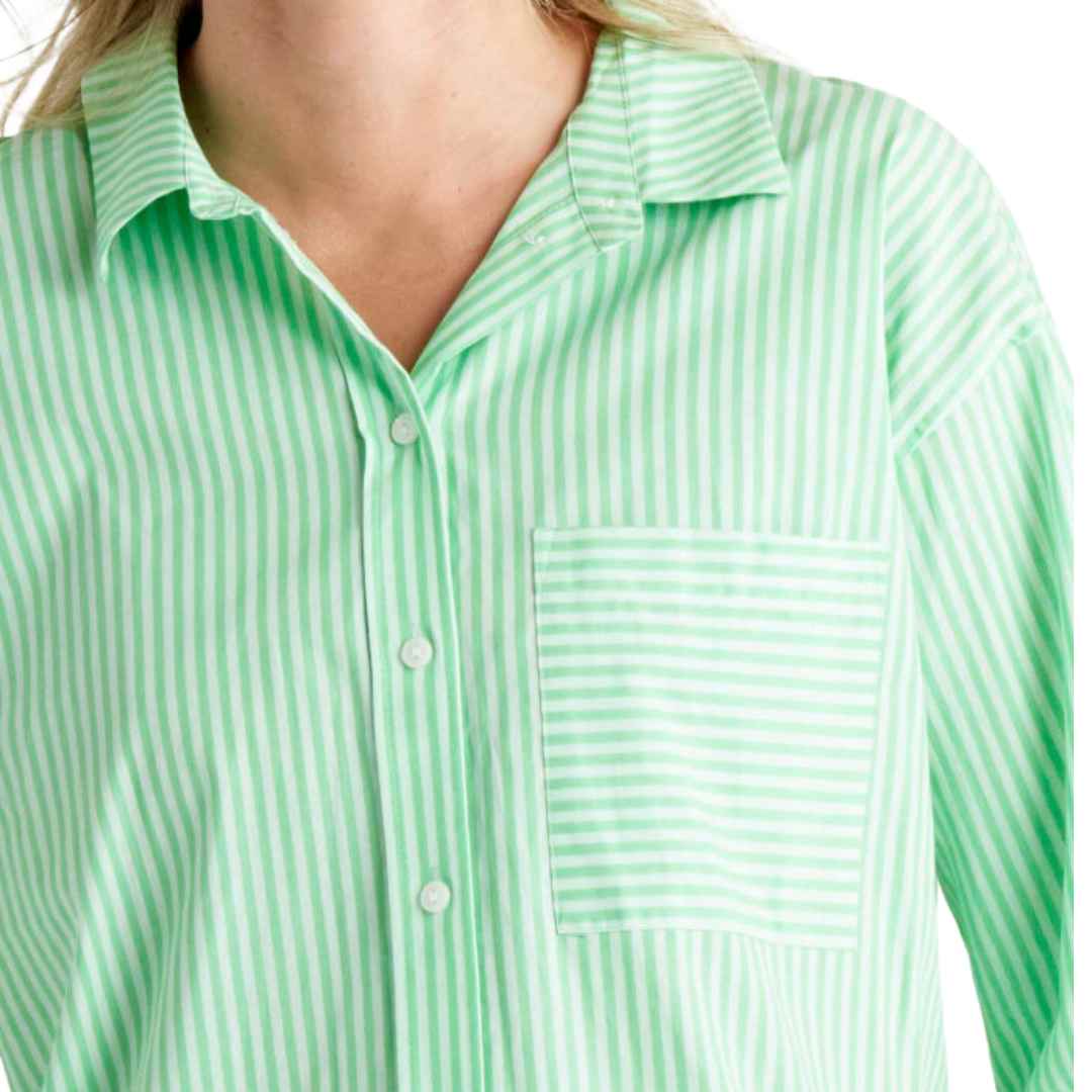 The Saskia Shirt from Betty Bascis in apple is a classic oversized shirt featuring a green and white vertical stripe. With a classic collar and button front placket, this shirt combines timeless style with a fun twist. The relaxed body fit ensures comfort and a carefree vibe.