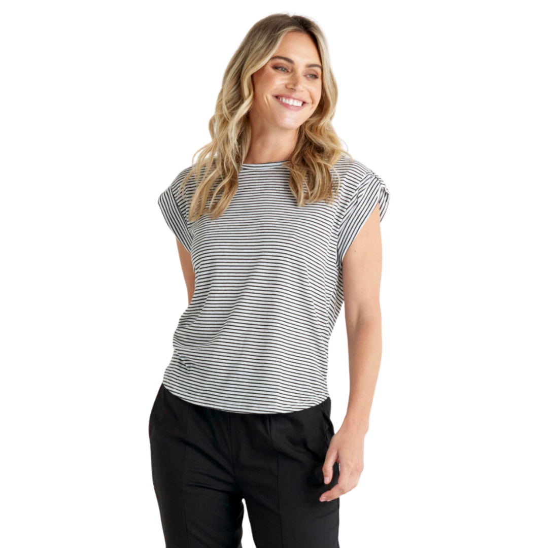 With a round neckline, short sleeves, a slightly curved high-low hem and rolled sleeve design the Gemma Roll Cuff Tee from Betty Basics can be easily styled by itself with pants and sneakers or can be used as a simple layering piece with a jacket or blazer on top.
