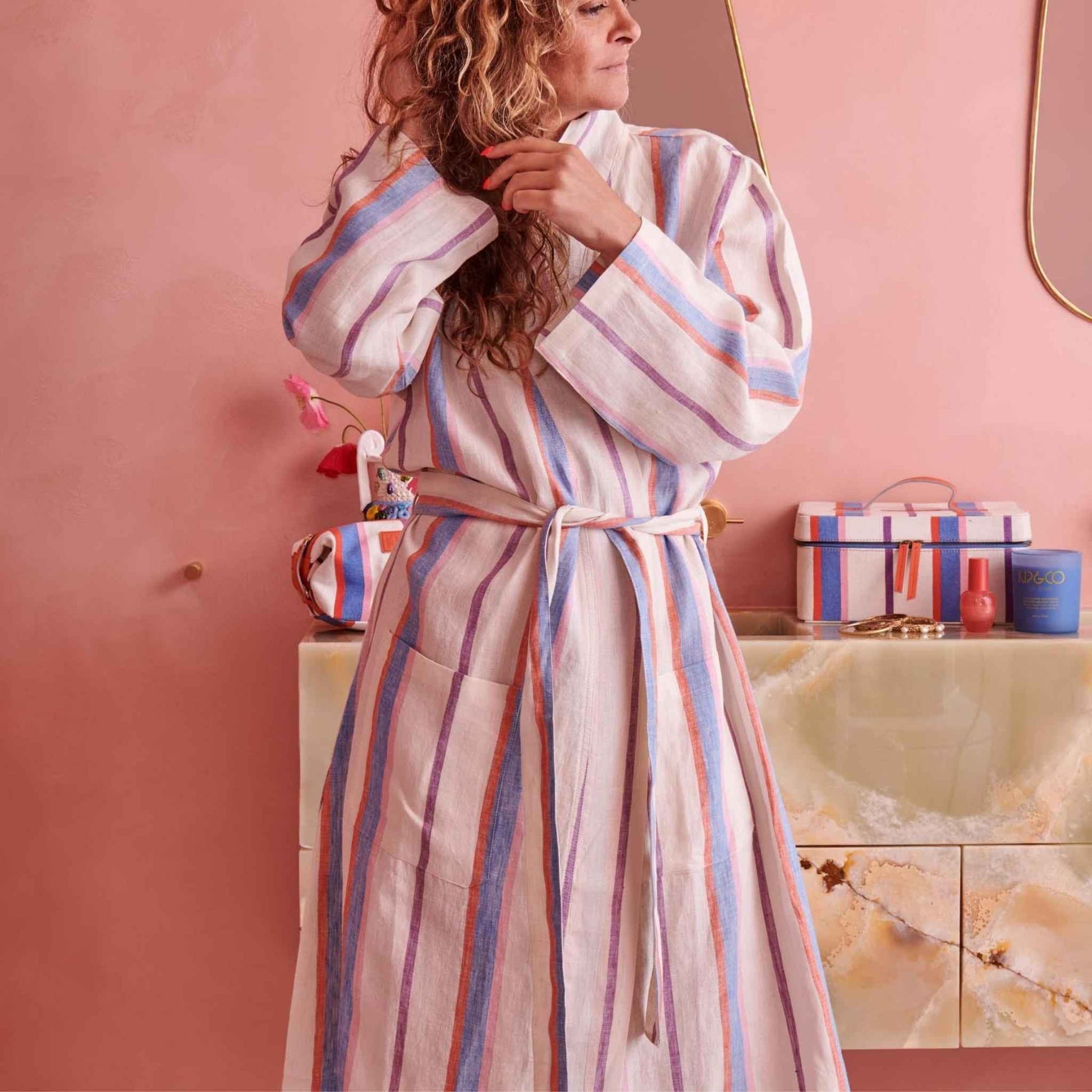  Featuring a blue, red, pink and purple stripe pattern on a white base.The Maldives Stripe Woven Linen Robe FROM KIP AND CO is the ideal light weight robe to get you through the warmer seasons.