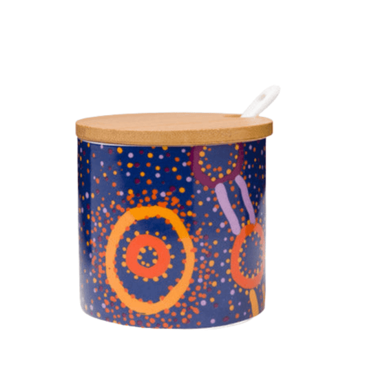 This fine porcelain sugar bowl with bamboo lid features an allover print based on artwork by Indigenous artist Watson Robertson from Warlukurlangu Artists. 