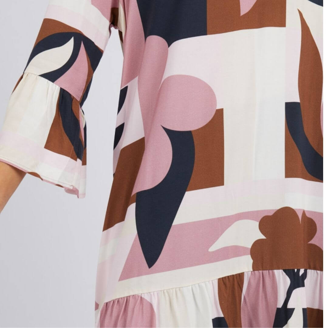Featuring an Elm exclusive print, the Abstraction Dress is a knee length dress on a cream base with dusty pink, chocolate and navy print. with frill detail at the sleeve and hem adds a playful and feminine touch.