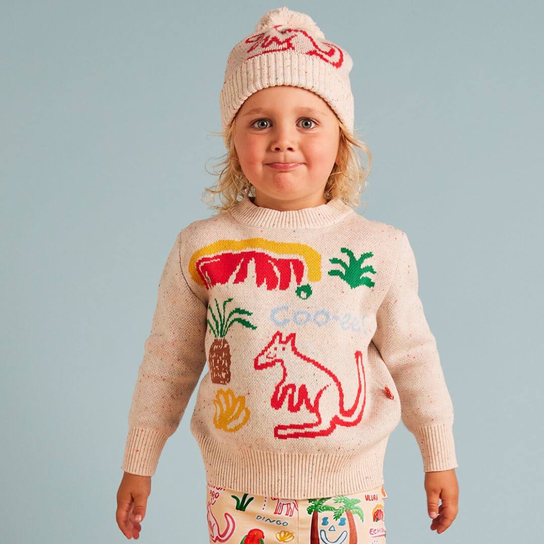 Halcyon Nights Sunny koala knit beanie is a super cute creamy speckled machine washable beanie featuring a super cute red kangaroo print and coo-ee! on the back.