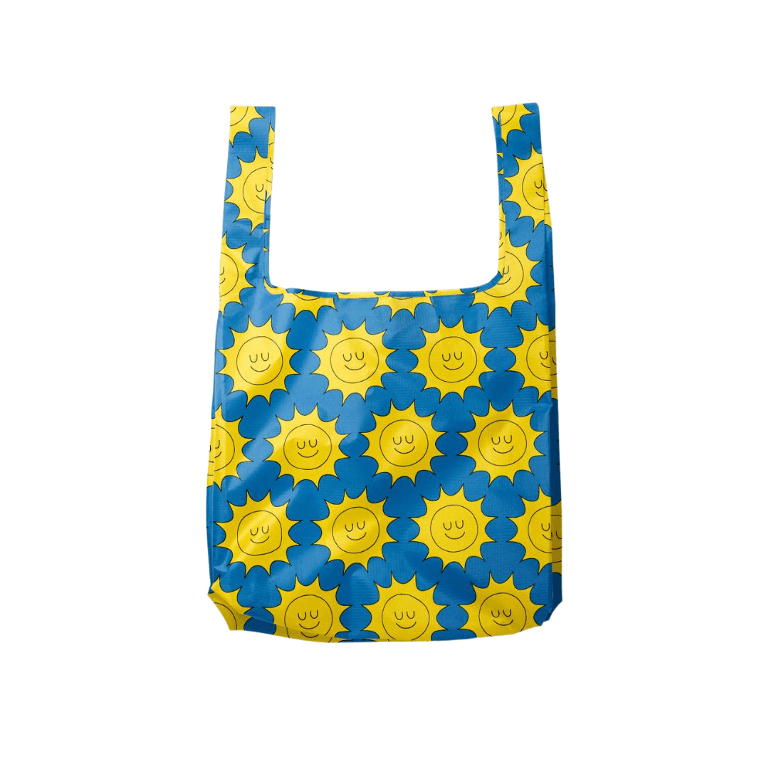 Georgia Perry delivers the sunshine with this blue reusable shopping bag with cute smiling suns printed on it.