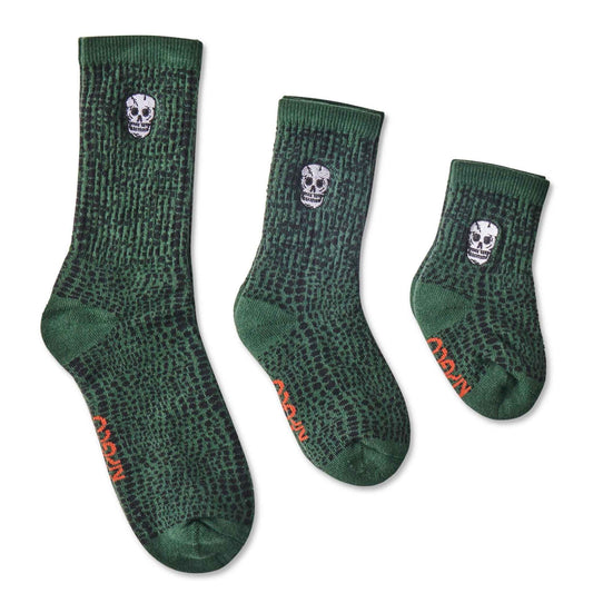 Featuring an embroidered skull motif, the Skull Socks are a dark green patterned crew style sports sock with black ankle stripe. Made for kids and adults!